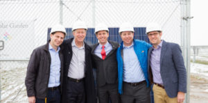 A group of men with hardhats on