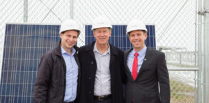 John Hickenlooper with a hardhat on