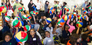 A group of children with beach balls