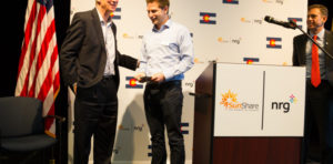 Group photo of sunshare gound breaking with John Hickenlooper