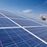 Worker on a solar panel