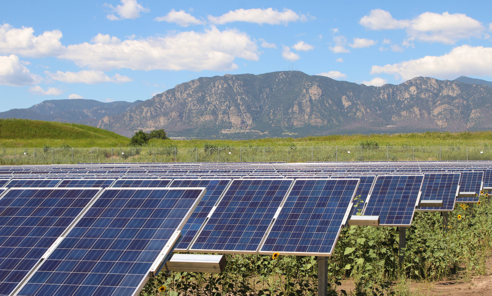 SunShare community solar garden solar panels and mountains